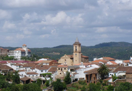 Why is the town of Jabugo known as the cot of Iberian ham?